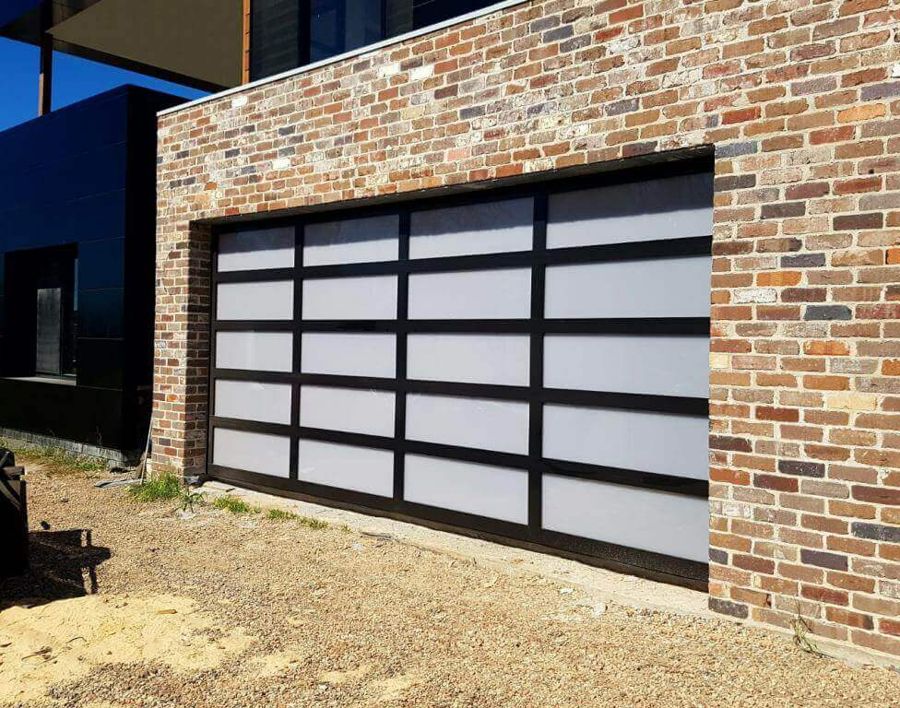 Garage door with black frame and frosted glass panels